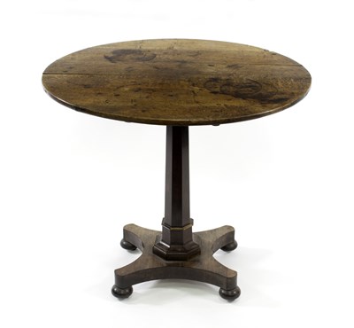 Lot 659 - A circular oak table with octagonal column and...