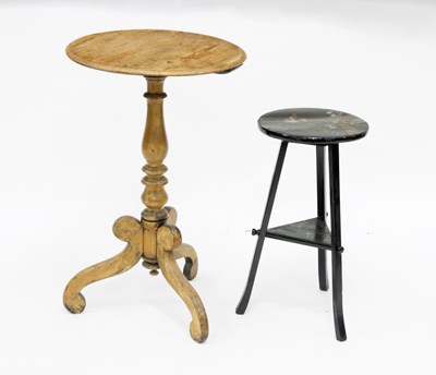 Lot 660 - A circular table with scroll supports and a...