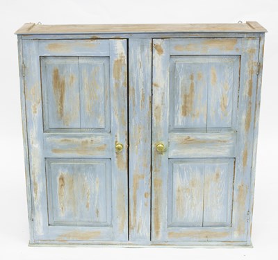 Lot 664 - A painted pine cabinet with twin panelled...