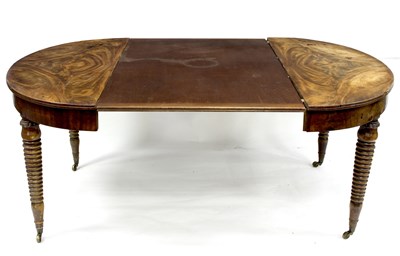 Lot 669 - A Regency mahogany oval dining table on bobbin...