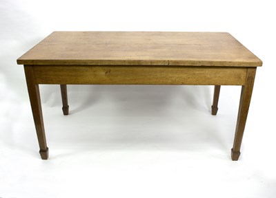 Lot 693 - A large oak table fitted two drawers on square...