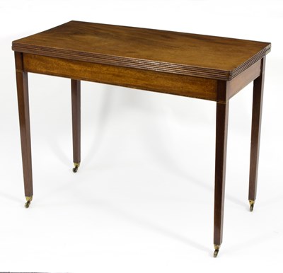 Lot 706 - A George III mahogany tea table, the fold-over...