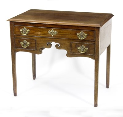 Lot 711 - A George III mahogany lowboy, fitted three...