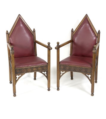 Lot 716 - A pair of Gothic Revival oak armchairs, the...