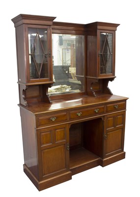 Lot 717 - A mahogany dresser, the mirror back flanked by...