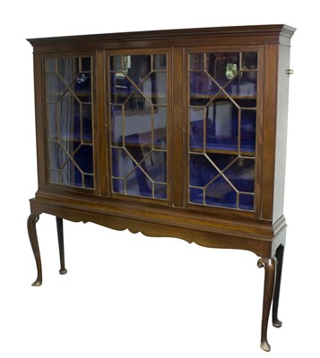 Lot 724 - A mahogany display cabinet, the dentil cornice...