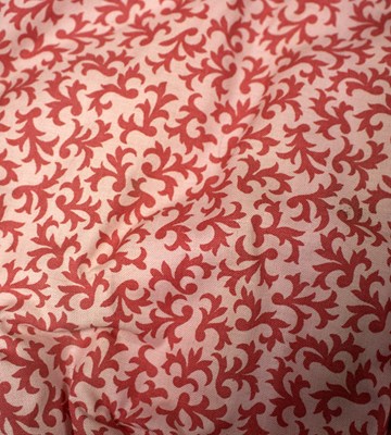 Lot 739 - A pair of red patterned interlined curtains,...