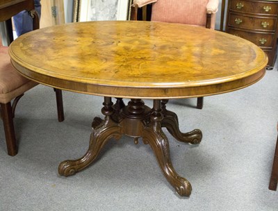 Lot 742 - A Victorian walnut loo table, the oval top...