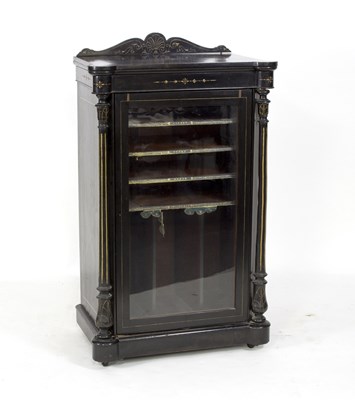 Lot 752 - A Victorian ebonised music cabinet enclosed by...