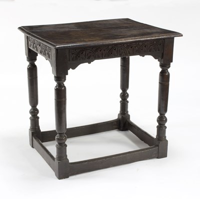 Lot 765 - A 17th Century oak table, the plank top above...