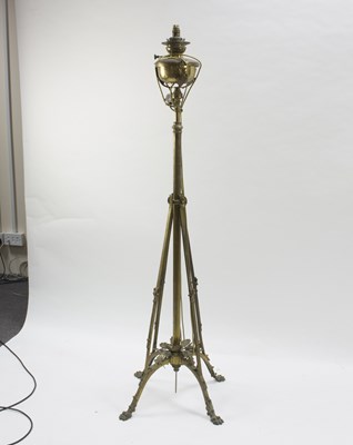 Lot 774 - A brass standard lamp in the manner of WAS...