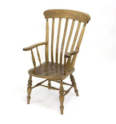 Lot 783 - A beechwood armchair, with rail back on turned...