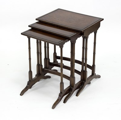 Lot 784 - A nest of three mahogany tables, the largest...