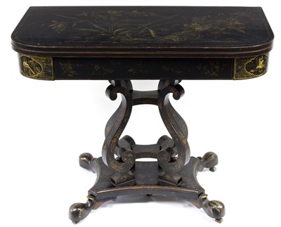 Lot 792 - A Regency fold-over games table with japanned...