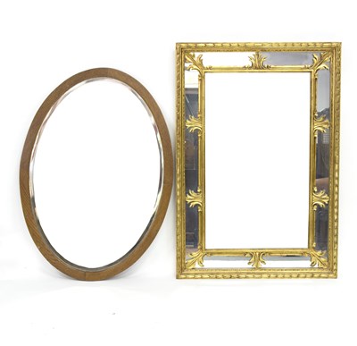 Lot 806 - A gilt framed mirror with decorative border,...