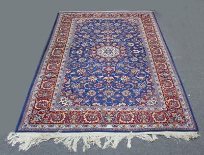 Lot 846 - A Tabriz carpet with floral blue ground...