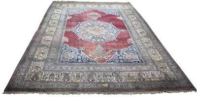 Lot 847 - A large Indian carpet with central blue ground,...