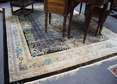 Lot 863 - A Chinese silk carpet, the central floral...