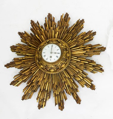 Lot 875 - A French starburst framed clock, the circular...