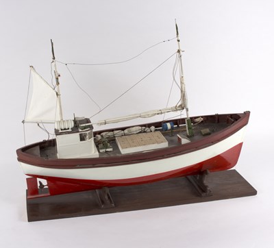 Lot 243 - A model fishing boat on a stand with rigging,...