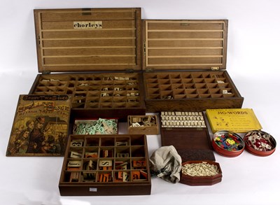 Lot 288 - Two wooden letter reading sets, cased, the...