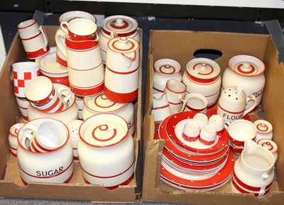 Lot 332 - A quantity of red and cream kitchenware...