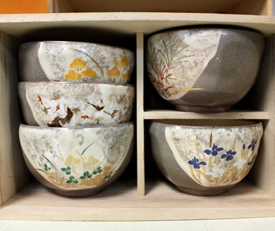 Lot 368 - Five Japanese cups and saucers in a fitted box...