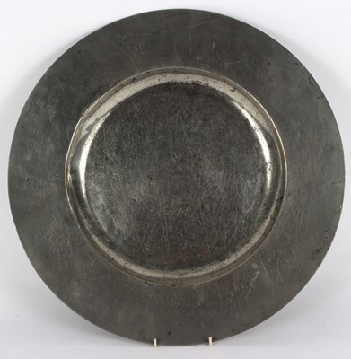 Lot 400 - A broad rimmed pewter charger, by William...