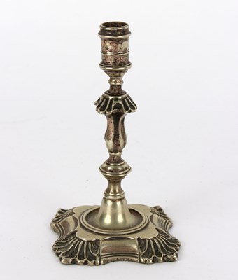 Lot 404 - A George II paktong taperstick, circa 1750,...