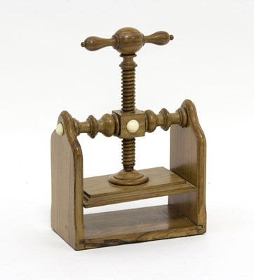 Lot 429 - A small olivewood book press, late 19th...