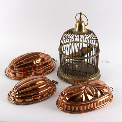 Lot 430 - Three ribbed copper blancmange moulds, the...