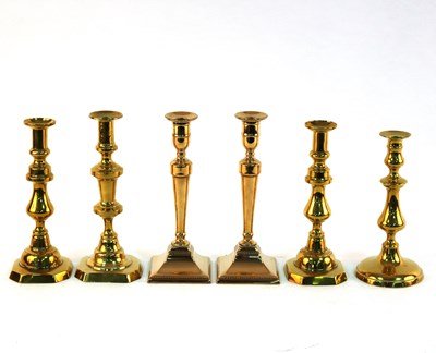 Lot 431 - Three baluster brass candlesticks, another and...