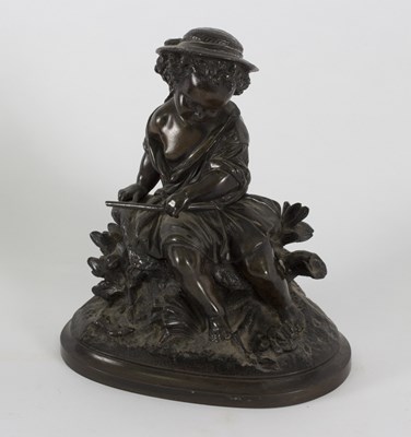 Lot 457 - A 19th Century bronze figure of a child seated...