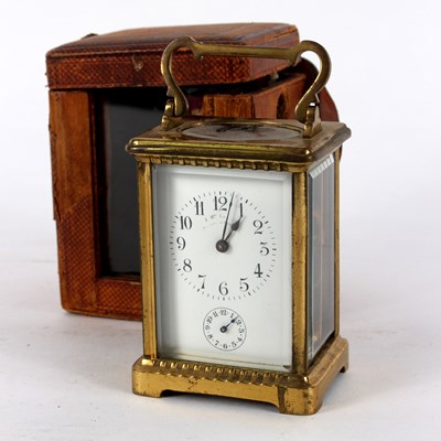 Lot 471 - A gilt brass cased carriage clock, the white...