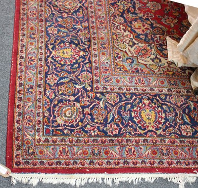 Lot 481 - An Eastern carpet, red ground with multiple...