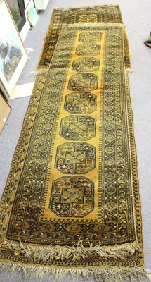 Lot 483 - Three Afghan rugs worked in black to a golden...