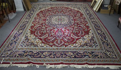 Lot 487 - An Eastern style carpet with all over stylised...