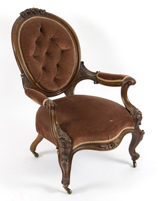 Lot 507 - A Victorian walnut framed button back armchair...