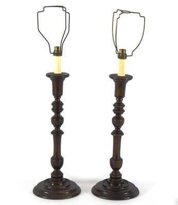 Lot 527 - A pair of turned wood lamp bases, 44cm high...