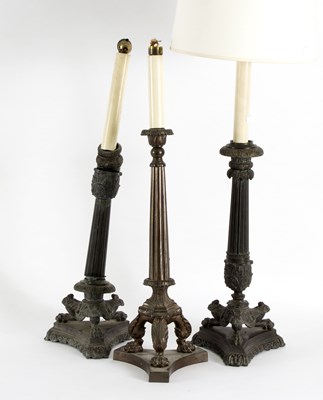 Lot 528 - A pair of bronze table lamps, of column form...