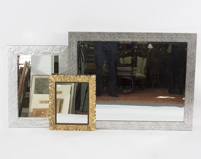 Lot 545 - A modern wall mirror, the bevelled glass,...