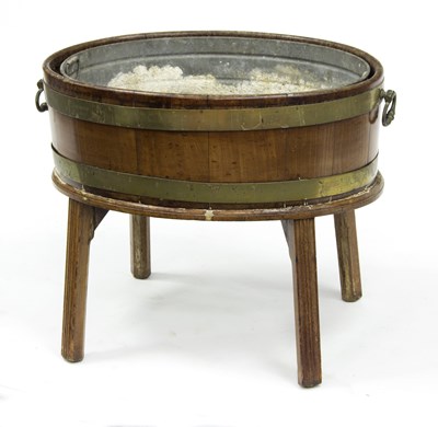 Lot 553 - A George III oval wine cooler, brass bound on...