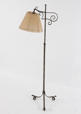 Lot 572 - An adjustable lamp on wrought iron stand with...