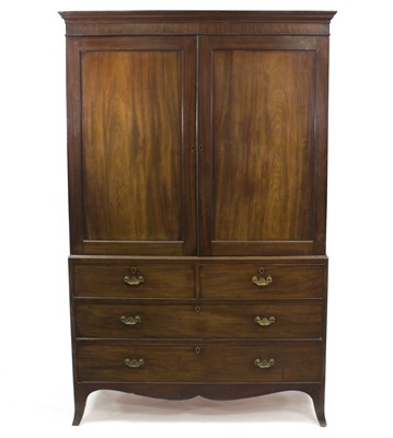 Lot 581 - A 19th Century mahogany linen press, the upper...