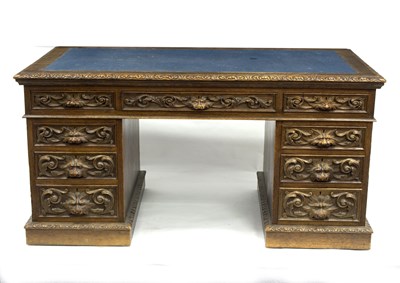 Lot 582 - A carved oak pedestal desk, fitted nine...