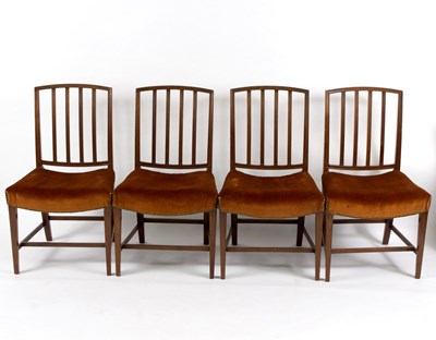 Lot 585 - A set of four rail back dining chairs