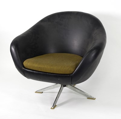 Lot 986 - A black leather tub chair with chrome stand