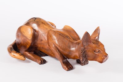 Lot 992 - A model of a crouching cat, carved in yew wood,...