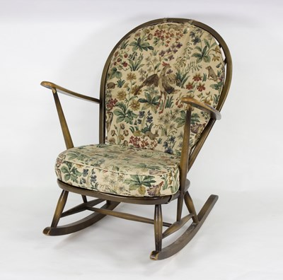 Lot 1004 - An Ercol rocking chair, with spindle back,...