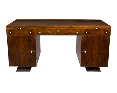 Lot 1017 - An Art Deco figured walnut pedestal desk in...